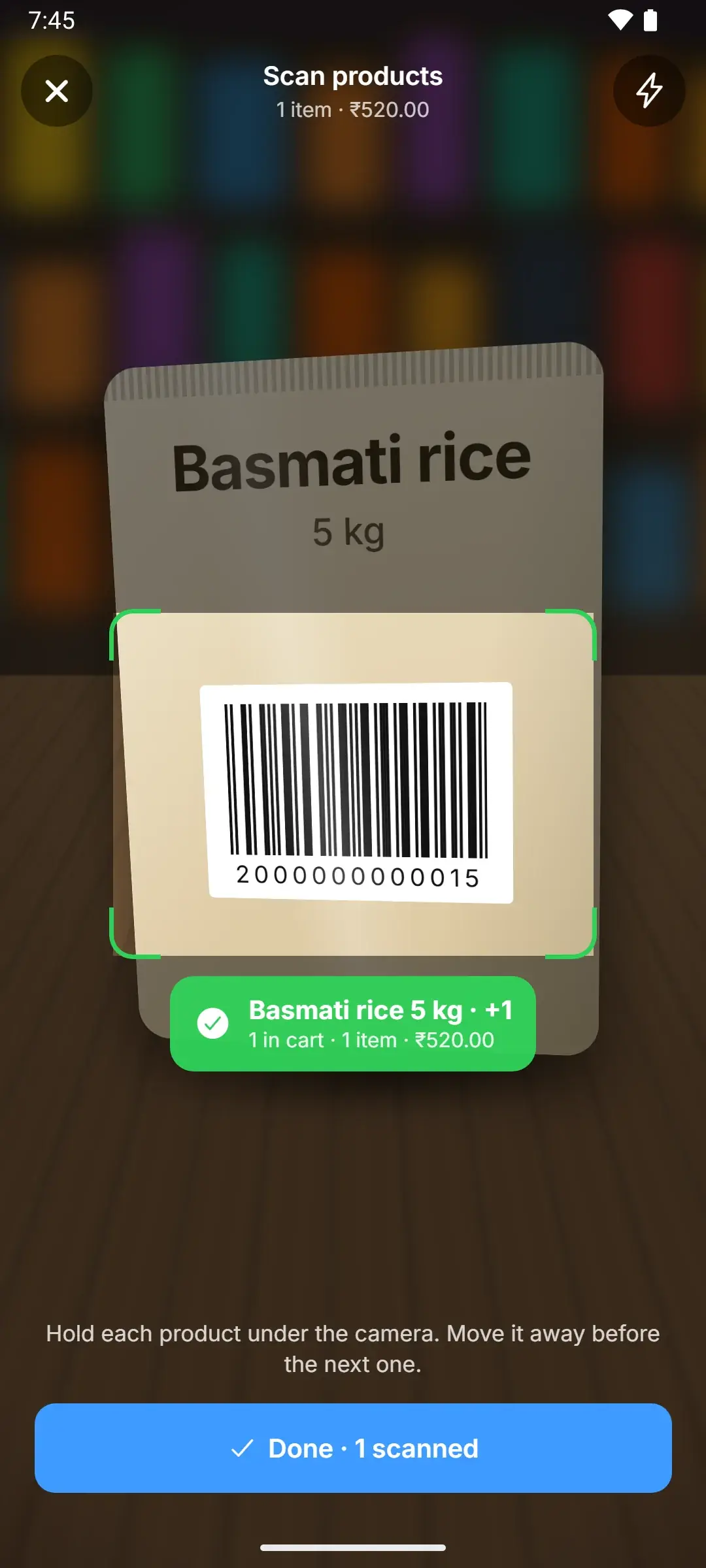 MOPX scanner reading the barcode on a pack of basmati rice and adding it to the bill